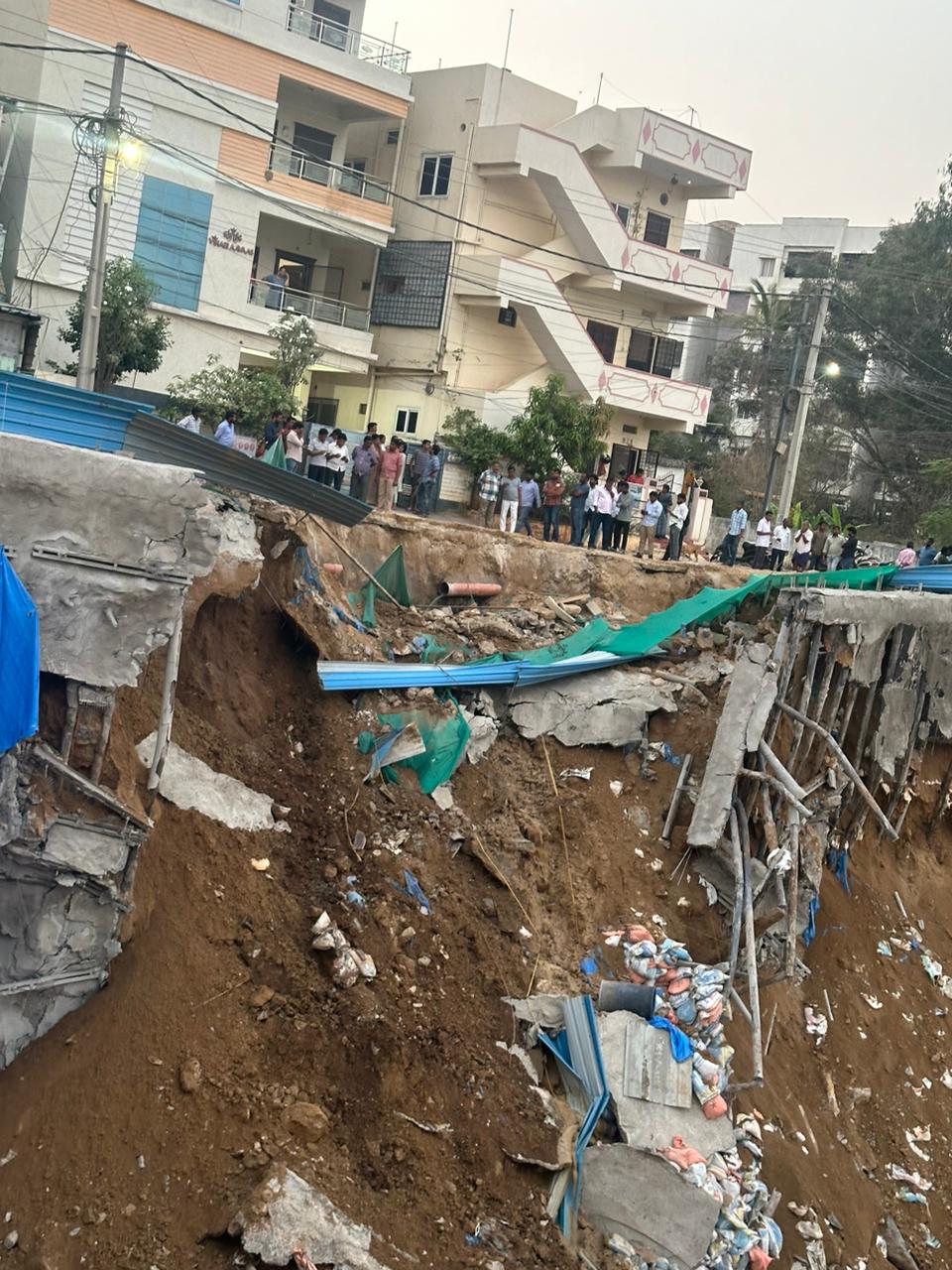 A portion of road caves in, locals blames illegal building