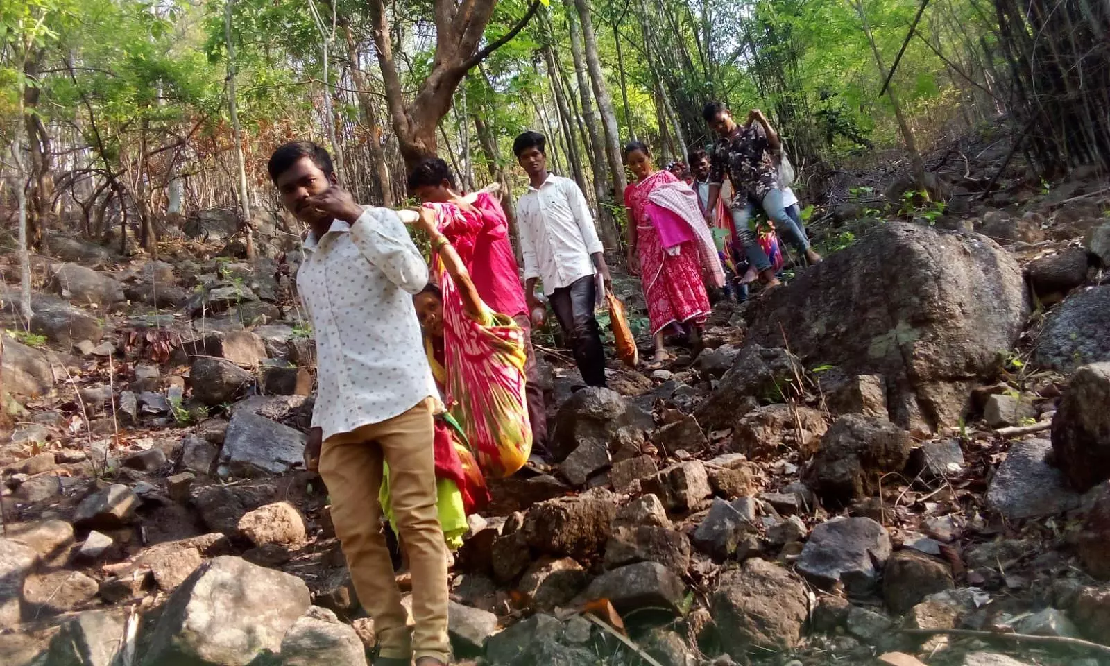 AP: Villagers carry elderly woman to polling station in Alluri Seetharama Raju District