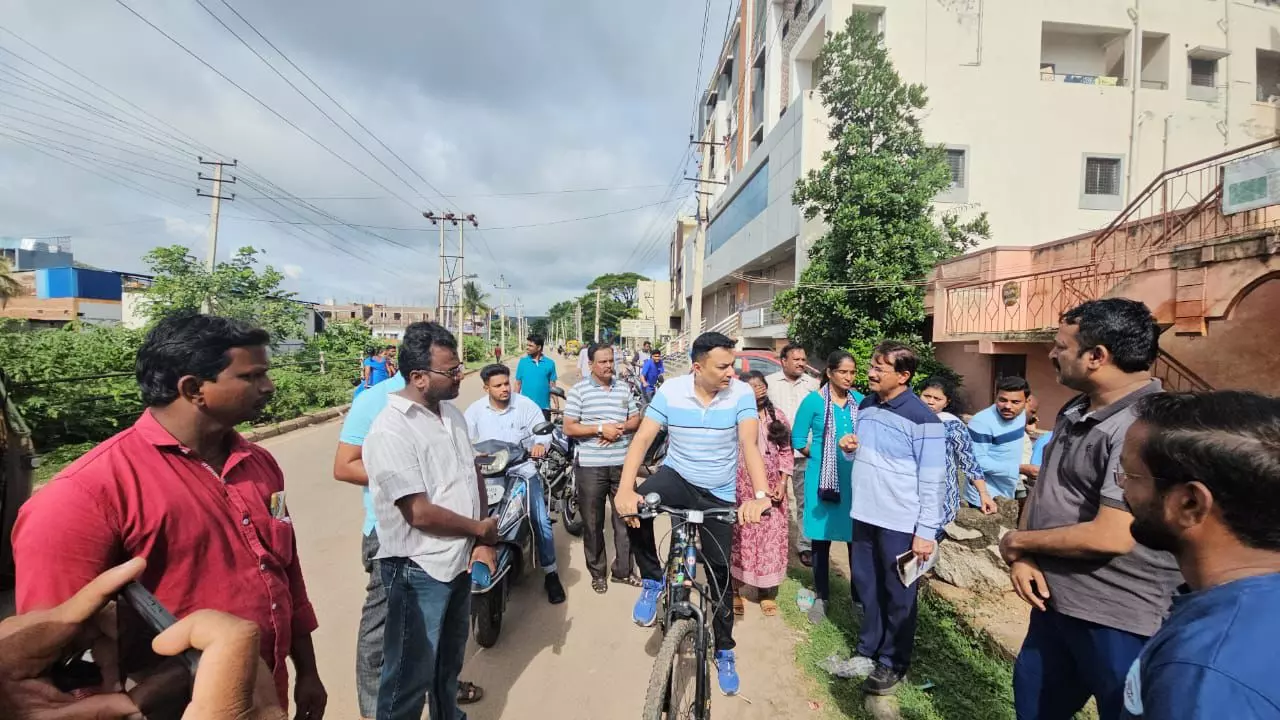 Vijayanagar district Dy commissioner takes cycle tour of Hospet to assess monsoon preparedness