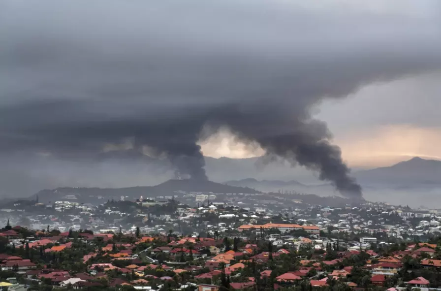 New Caledonia reopening its international airport and shortening curfew as unrest continues to ebb