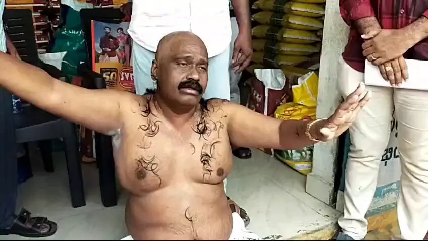 YSRC leader stages half naked protest for demolishing his building in Vijayawada