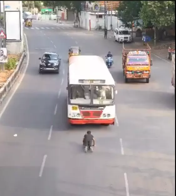 Fact Check: Viral video showing a man laying on the road even while an RTC bus is approaching him is fake