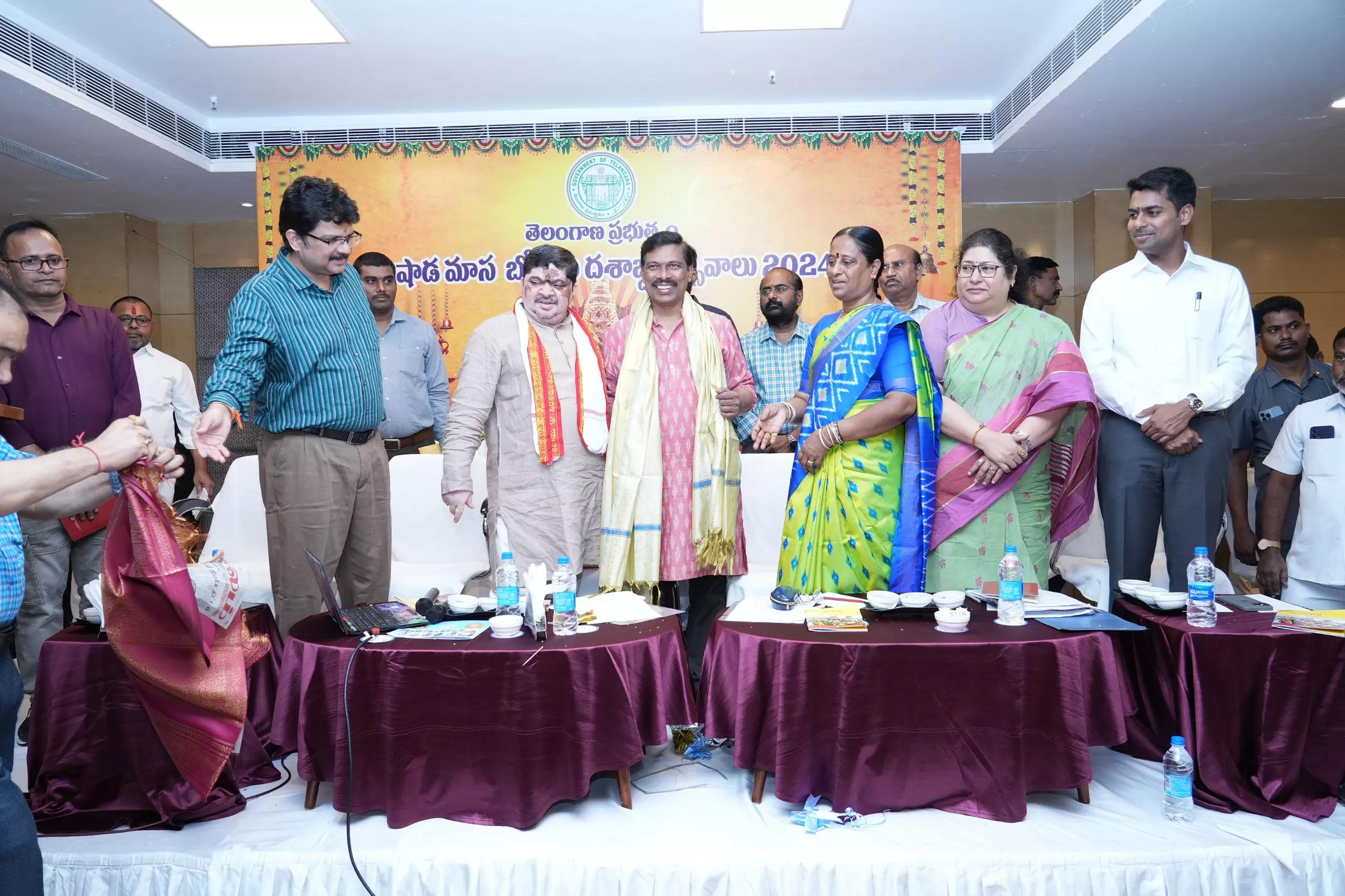 Minister Konda Surekha distributes cheques to temple committees for Bonalu celebrations