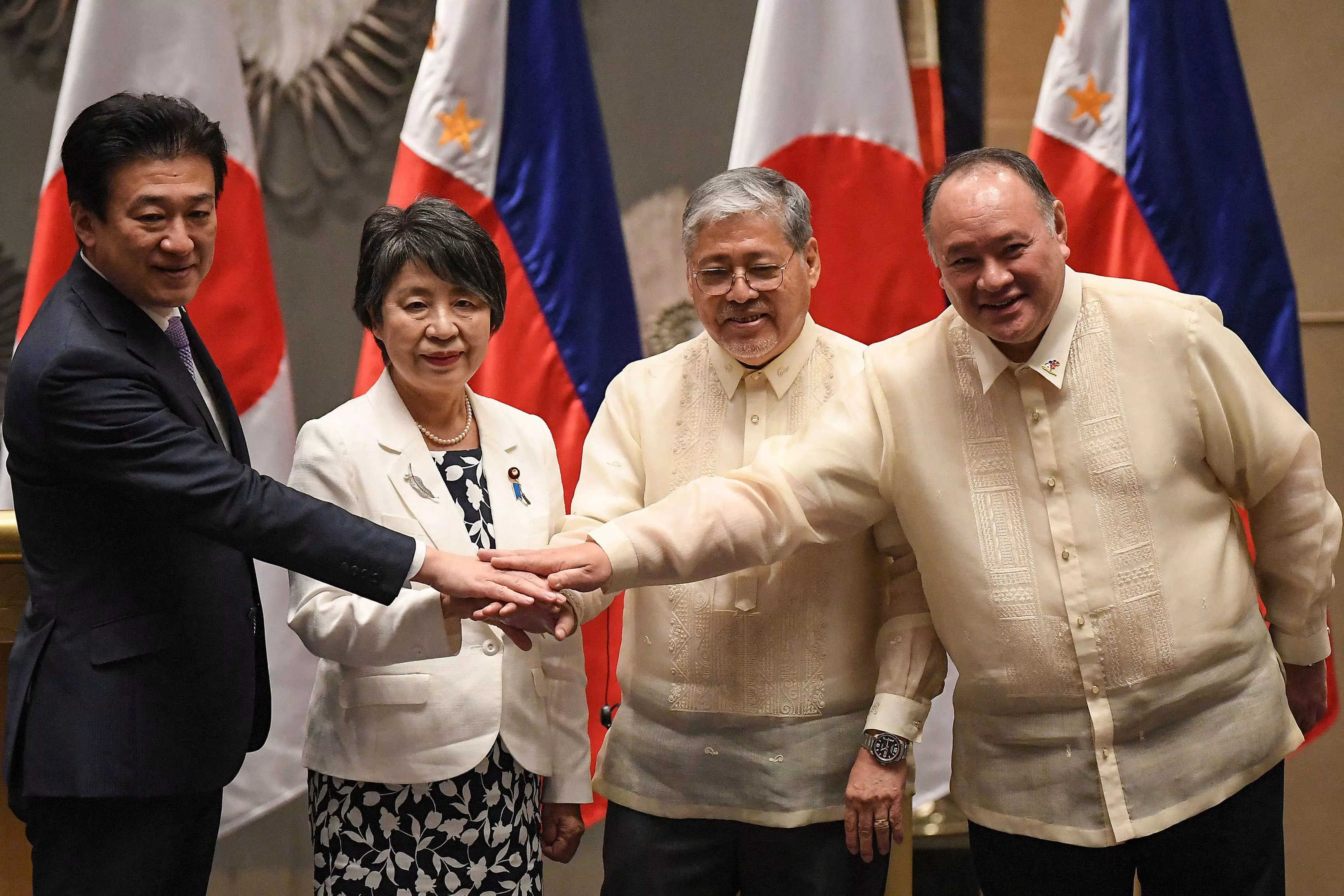 Japan, Philippines sign key defense pact as both countries face an alarm over China