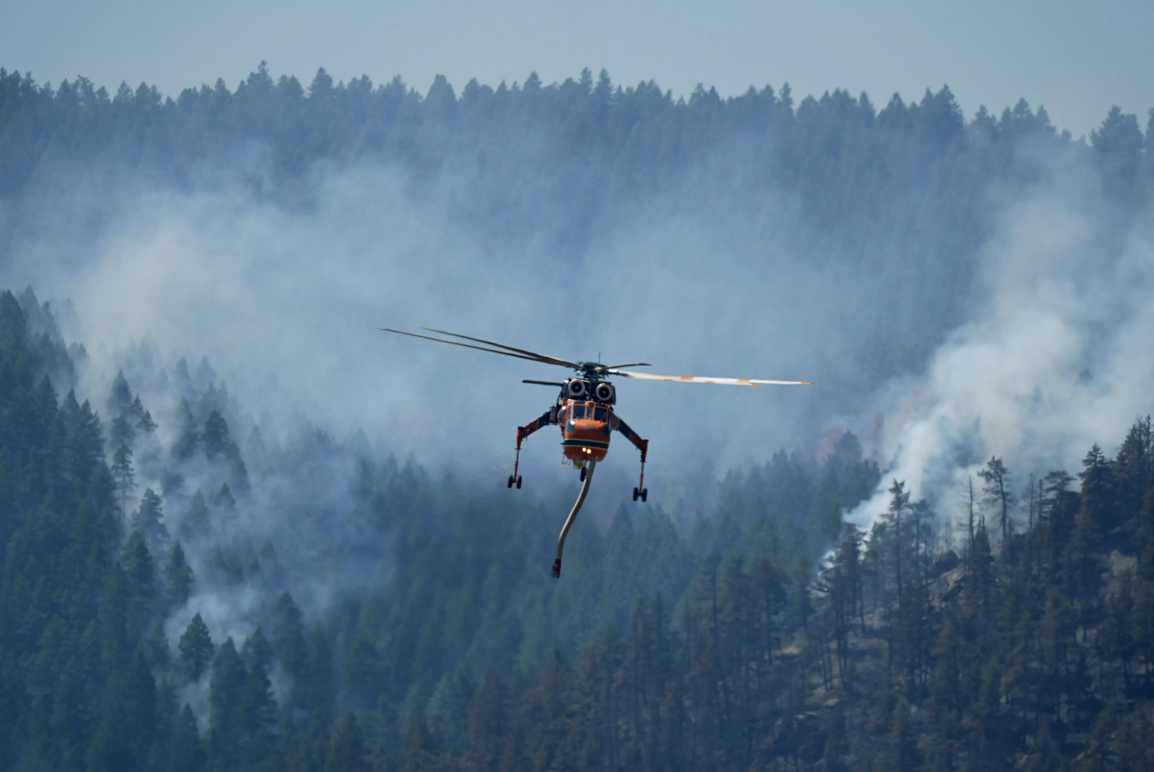 Wildfires in Colorado burn dozens of homes and structures, threaten hundreds more