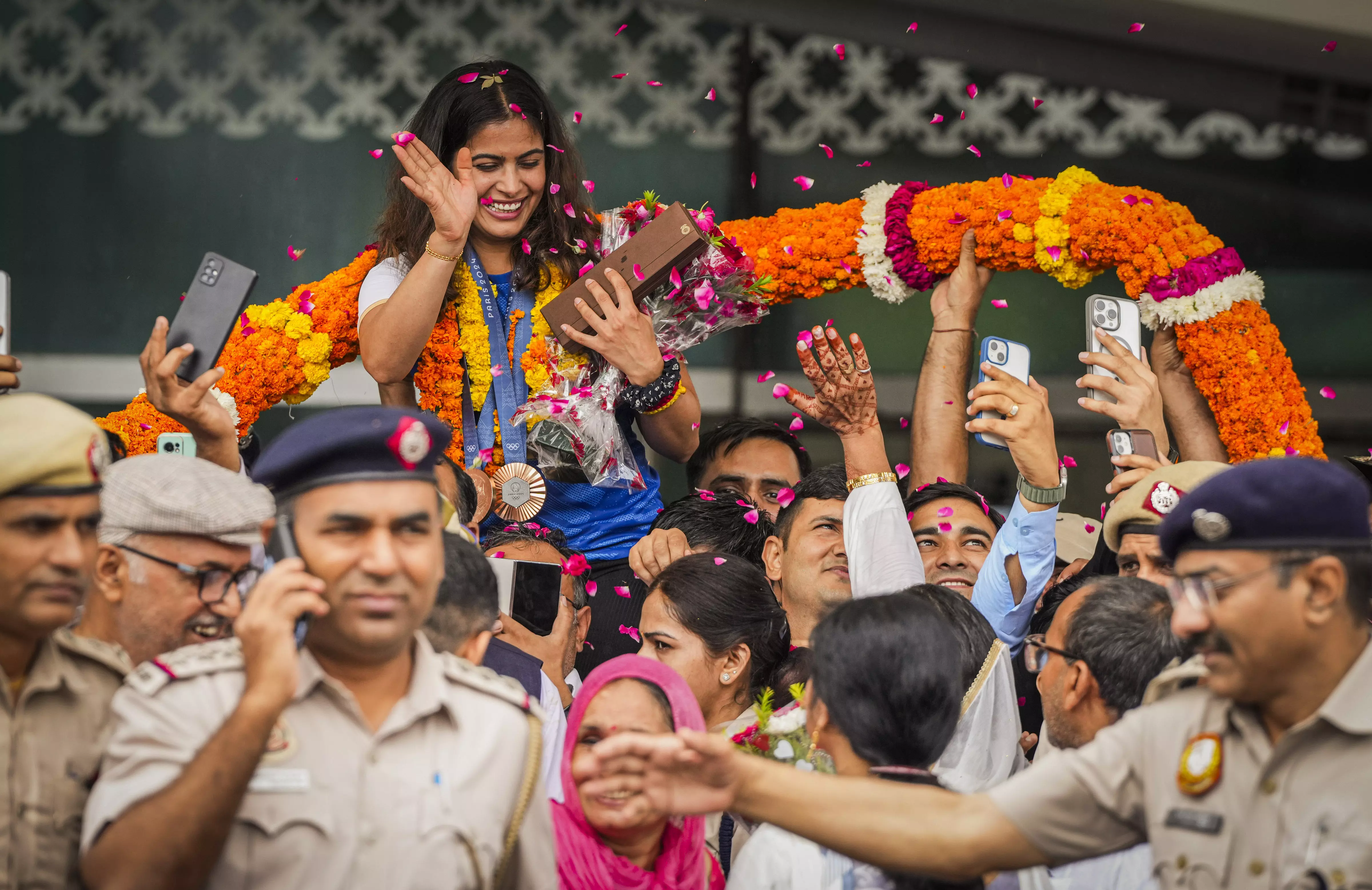 History-making Manu Bhaker arrives home to enthusiastic reception