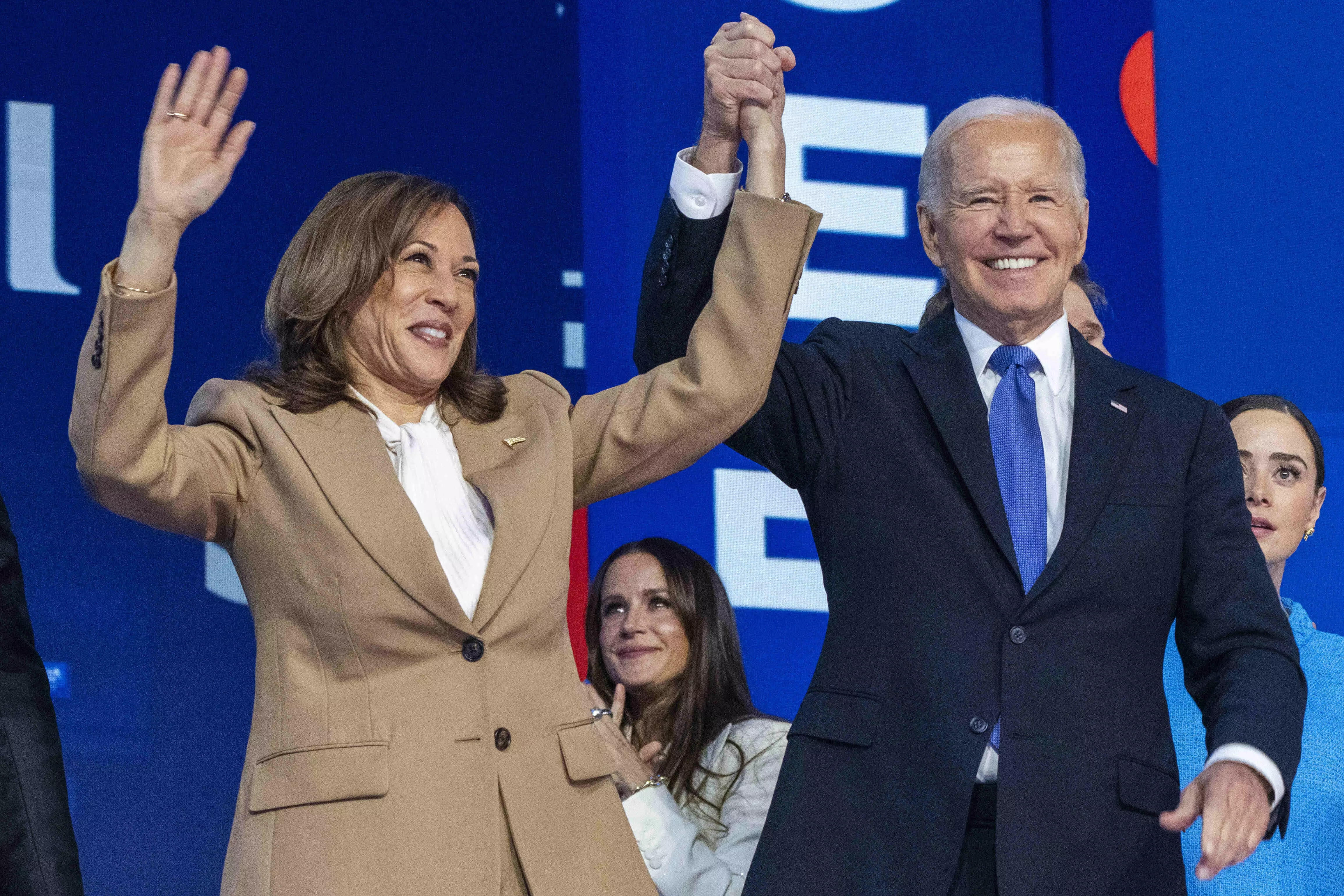 Biden passes the baton to Harris, says she will be a historic president