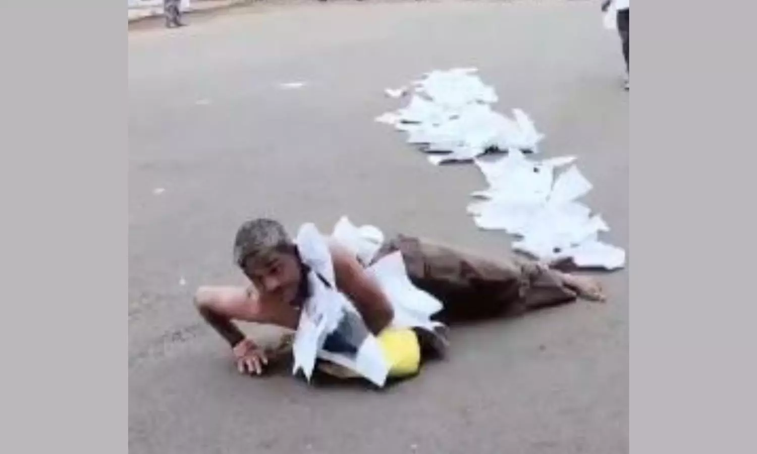 Man crawls wearing garland of complaints as he protests against sarpanch