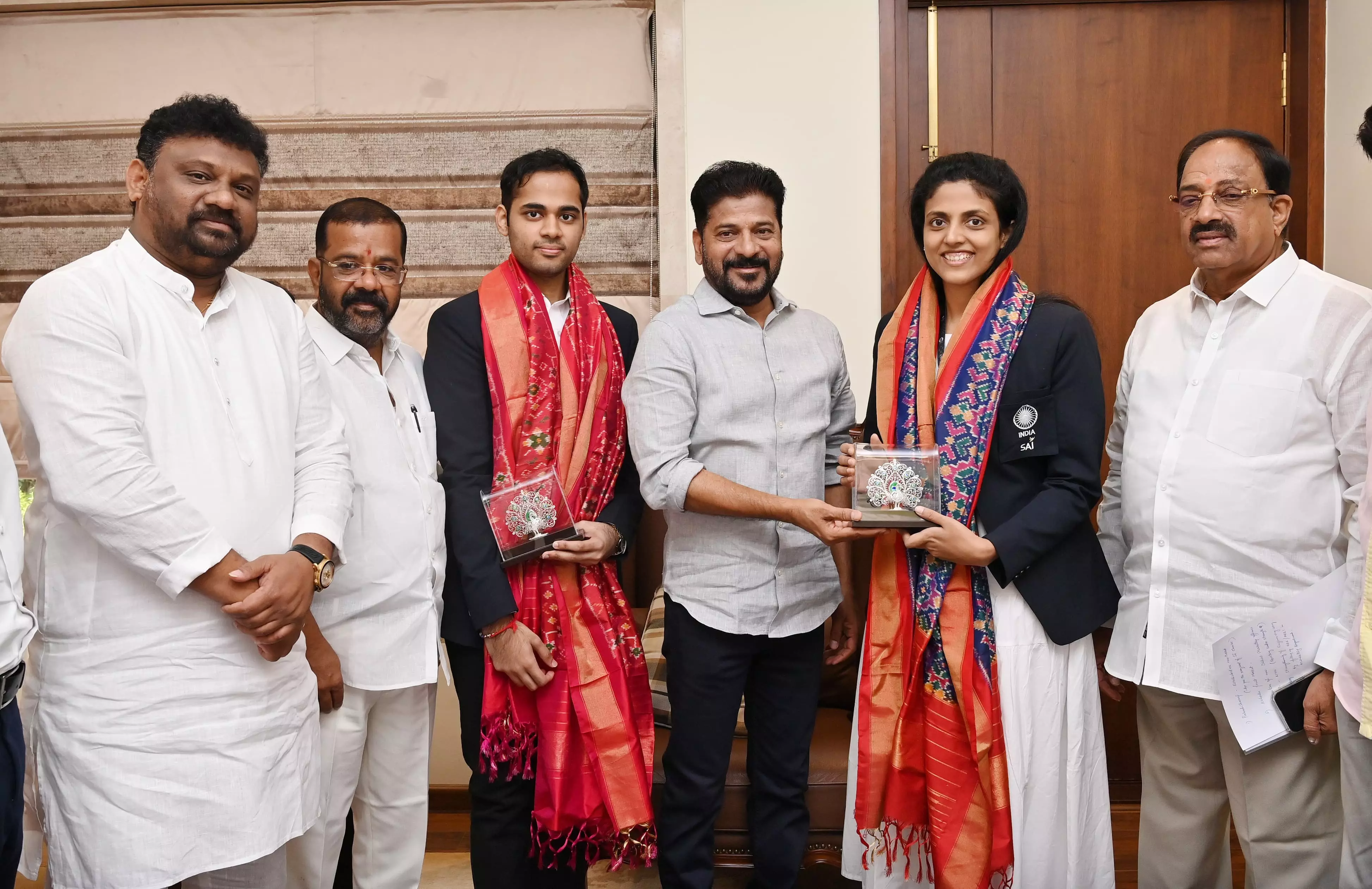 CM Revanth Reddy announces Rs.25 lakh each rewards to chess players Arjun, Harika