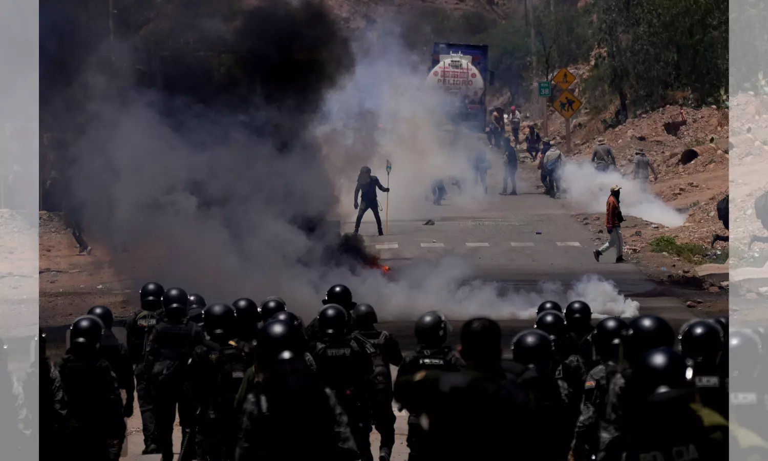 Supporters of Bolivian ex-president storm military barracks, take soldiers hostage