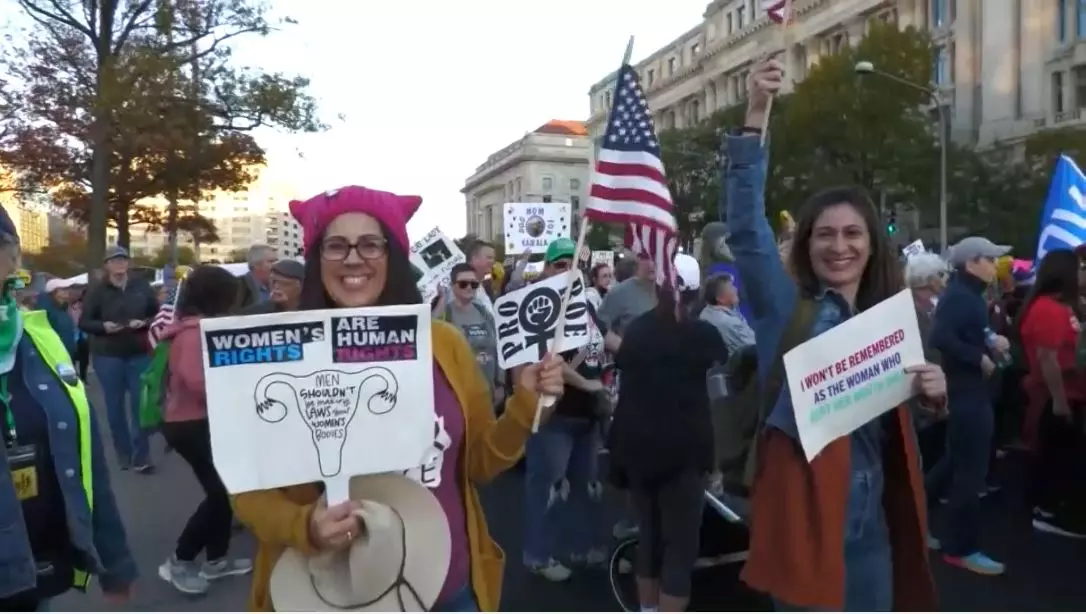 Womens march protesters gather to Kamala Harris