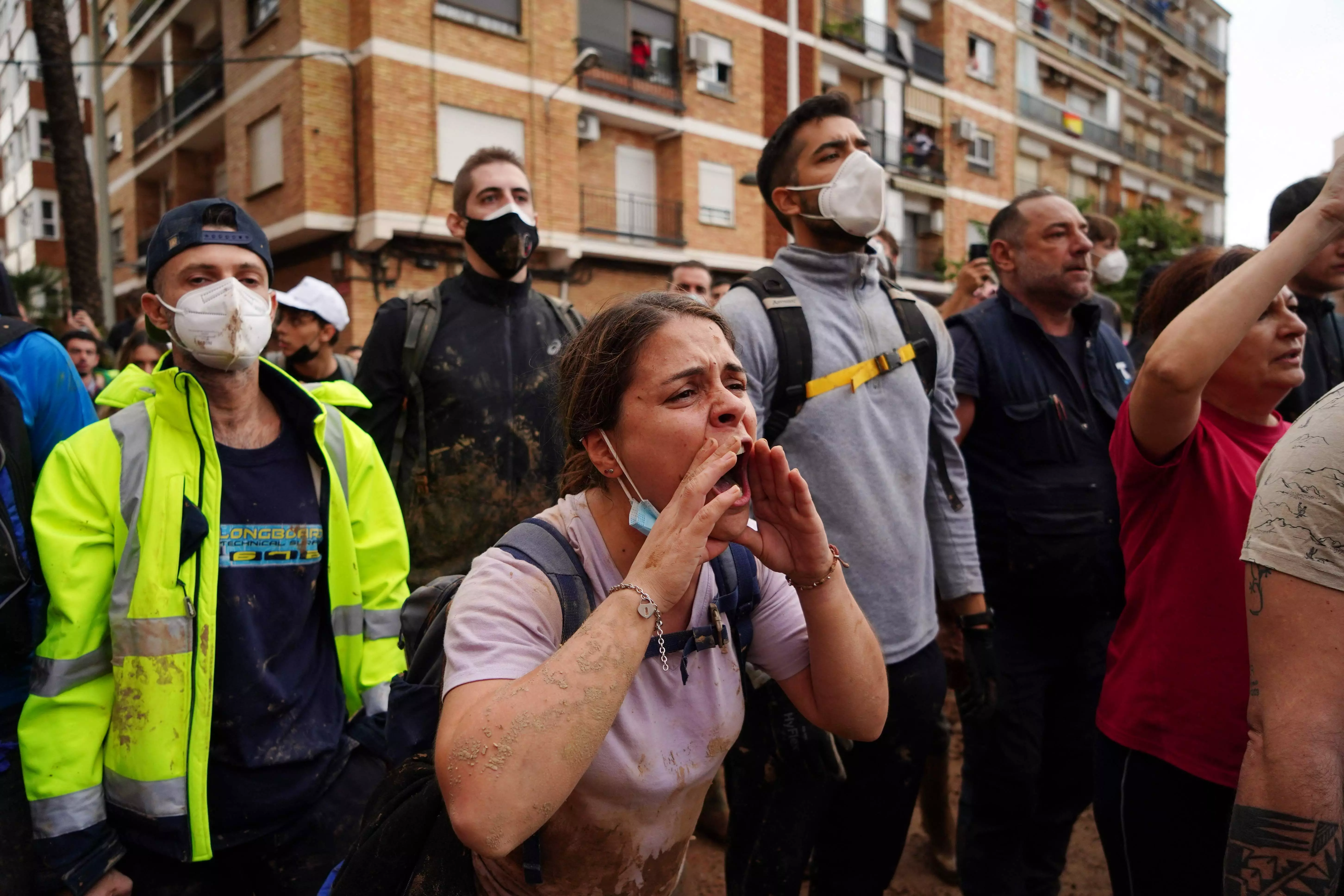 A crowd of Spains flood survivors toss mud and shout insults at King Felipe VI