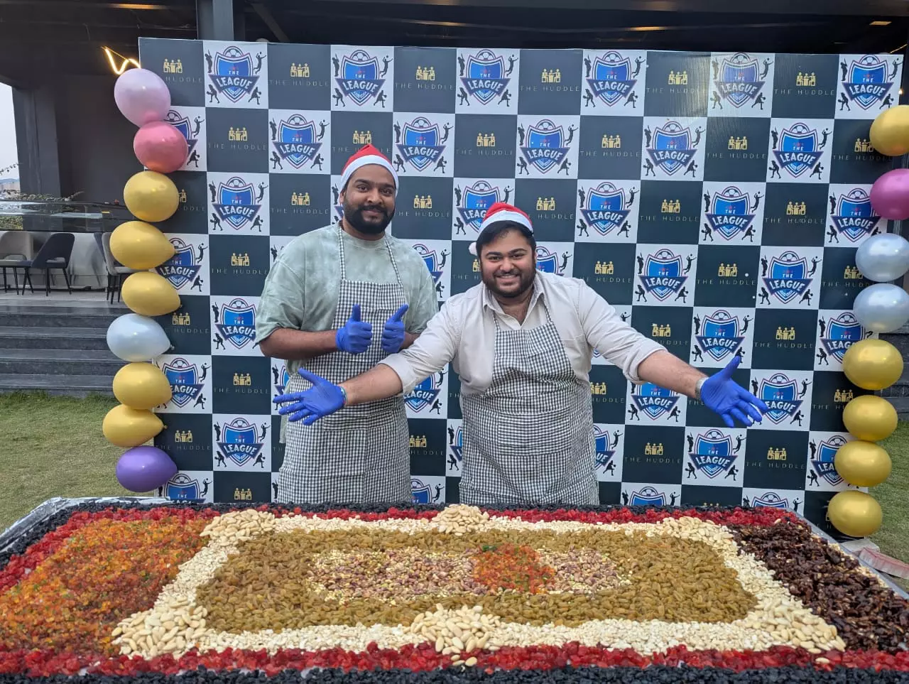 L-R Mr. R V Rajgopal, Partner at Shree Venkateshwara Group of Hotels and Mr. Monish R. Srinivasan, Partner at Shree Venkateshwara Hotels at The Cake-Mixing Event Hosted by Huddle.