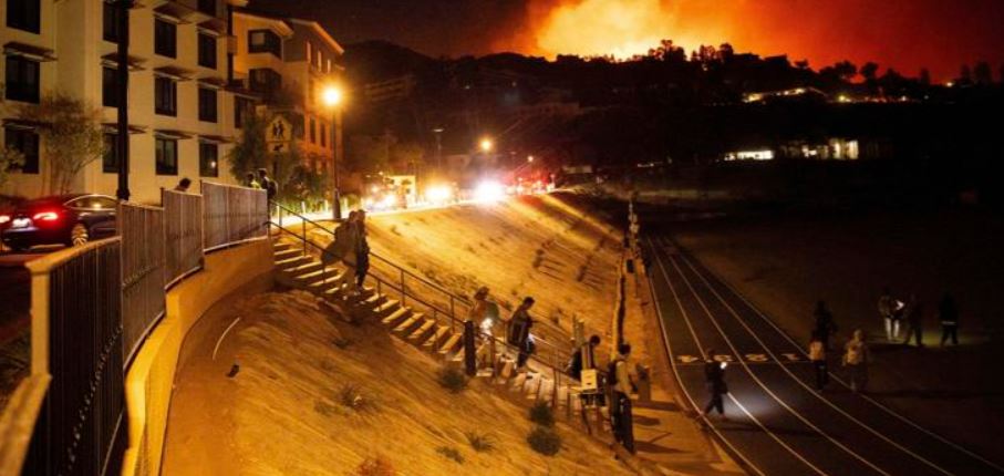 Homes burn as wind-driven wildfire prompts evacuations in Malibu, California